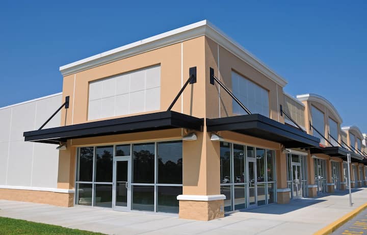 Bright red commercial awning in The Villages, FL.